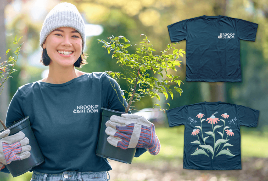 The image depicts a young woman wearing a dark blue Brook & Bloom shirt. The shirt design is displayed next to her in the image.